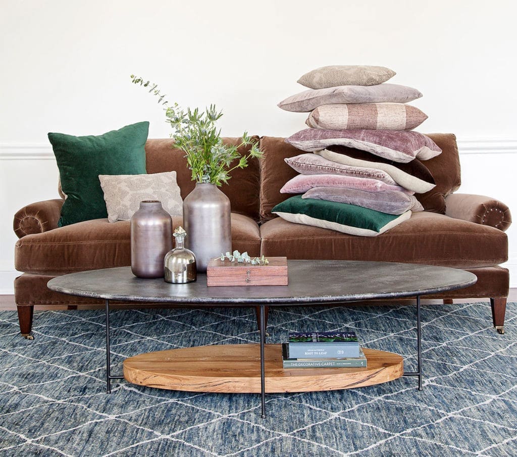 Upholstered sofa with colorful bold upholstered accent pillows